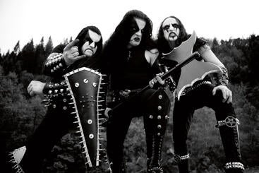 Three men with black and white facepaint holding fake weapons. 